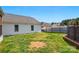 Backyard featuring a white home and a grassy area at 2425 Barkers Ridge Dr, Bessemer City, NC 28016
