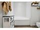 Bathroom featuring soaking tub and storage cabinet at 2425 Barkers Ridge Dr, Bessemer City, NC 28016