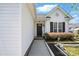 Inviting front entrance with neat landscaping and charming details, showcasing the home's welcoming curb appeal at 2425 Barkers Ridge Dr, Bessemer City, NC 28016