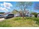 Well-manicured lawn and landscaping enhance the curb appeal of this lovely home, featuring mature shade trees at 2425 Barkers Ridge Dr, Bessemer City, NC 28016