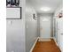 Bright hallway with hardwood floors, leading to a front door and closet spaces, offers practicality and style at 2425 Barkers Ridge Dr, Bessemer City, NC 28016