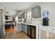 Well-lit kitchen with gray cabinets, wine coolers, a water cooler, and stainless steel appliances at 2425 Barkers Ridge Dr, Bessemer City, NC 28016