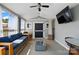 Inviting sunroom featuring a comfortable sofa and multiple windows, allowing abundant natural light at 2425 Barkers Ridge Dr, Bessemer City, NC 28016