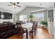 Combined living and dining space with a fireplace, TV, and natural light; blends relaxation and dining seamlessly at 2425 Barkers Ridge Dr, Bessemer City, NC 28016