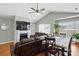 Spacious living room featuring a fireplace, vaulted ceilings, and natural light, perfect for relaxing and entertaining at 2425 Barkers Ridge Dr, Bessemer City, NC 28016