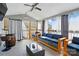 Bright sunroom features a sectional sofa, glass coffee table, and many windows, creating an inviting space at 2425 Barkers Ridge Dr, Bessemer City, NC 28016