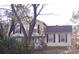 Charming two-story home with a traditional design and a well-maintained front yard partially obscured by trees at 2508 Wood Star Ct, Matthews, NC 28105