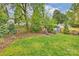 Backyard with a play area and landscaped garden with a wooden fence at 2529 Daniel St, Charlotte, NC 28205