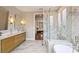 Elegant bathroom features double sinks, soaking tub, separate glass shower, and stylish tile at 2529 Daniel St, Charlotte, NC 28205