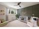 Charming bedroom with a wood accent wall, crib, and lots of natural light at 2529 Daniel St, Charlotte, NC 28205