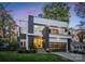 Modern two-story home with striking architectural details and a yellow front door at 2529 Daniel St, Charlotte, NC 28205
