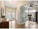 Inviting foyer with modern doors, hardwood floors, and a view of a home office at 2529 Daniel St, Charlotte, NC 28205