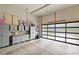 Organized garage featuring storage cabinets, a workbench, and modern garage door at 2529 Daniel St, Charlotte, NC 28205