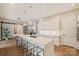 Modern kitchen boasts white cabinets, a large island with seating, and stainless steel appliances at 2529 Daniel St, Charlotte, NC 28205