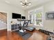 Bright exercise room features hardwood floors, modern lighting, and a window view at 266 Iverson Way, Charlotte, NC 28203