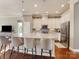 Spacious kitchen with a large island, bar stool seating, stainless steel appliances, and ample counter space at 266 Iverson Way, Charlotte, NC 28203