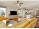 Open-concept living room and kitchen with hardwood floors and comfortable seating at 266 Iverson Way, Charlotte, NC 28203