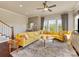 Spacious living room with hardwood floors, large windows, and a comfortable yellow sectional sofa at 266 Iverson Way, Charlotte, NC 28203