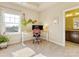 Bright home office with a tray ceiling, a large window, and a comfortable workspace at 266 Iverson Way, Charlotte, NC 28203