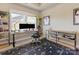 Bright home office with a computer, desk, a rug, a bookcase, and a picture of a baseball player at 266 Iverson Way, Charlotte, NC 28203