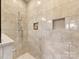 Modern shower with tile surround and recessed niche storage at 266 Iverson Way, Charlotte, NC 28203