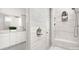 Modern bathroom featuring gray marbled tiles, glass enclosed shower, and white cabinetry with dual sinks and modern faucets at 2768 Suffolk Pl, Fort Mill, SC 29715