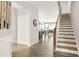 Foyer featuring hardwood floors, stairs to the second floor, and an open floor plan at 2768 Suffolk Pl, Fort Mill, SC 29715
