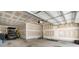 Spacious unfinished garage with a golf cart, coated floors, and plenty of room for storage or workshop space at 2768 Suffolk Pl, Fort Mill, SC 29715