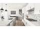 Kitchen featuring white cabinets, a large island with seating, and stainless steel appliances at 2768 Suffolk Pl, Fort Mill, SC 29715