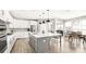 Kitchen featuring white cabinets, a large island with seating, and stainless steel appliances at 2768 Suffolk Pl, Fort Mill, SC 29715
