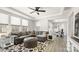 Bright open living area with a gray sectional sofa and large windows at 2768 Suffolk Pl, Fort Mill, SC 29715
