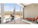 Relaxing sunroom featuring natural light, modern patio furniture, and outdoor access to backyard and patio at 2768 Suffolk Pl, Fort Mill, SC 29715