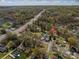Aerial view of neighborhood featuring this charming home and surrounding trees at 300 Bell St # 80, Mount Holly, NC 28120