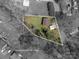 Aerial view of a property with approximate lot lines, showcasing the home and surrounding landscape at 300 Bell St # 80, Mount Holly, NC 28120