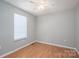 A cozy bedroom featuring hardwood floors and a ceiling fan with great natural light at 300 Bell St # 80, Mount Holly, NC 28120