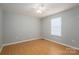 Cozy bedroom with hardwood floors, neutral paint, and natural light from the window at 300 Bell St # 80, Mount Holly, NC 28120