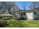 Exterior side view of home with a covered porch, carport and chain link fence at 300 Bell St # 80, Mount Holly, NC 28120