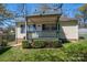 Charming home with a covered front porch and well-maintained landscaping at 300 Bell St # 80, Mount Holly, NC 28120