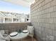 Covered balcony with outdoor dining set and view of the neighborhood at 301 E Tremont Ave, Charlotte, NC 28203