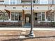 Building entrance with natural stone accents, covered walkway, and well maintained landscaping at 301 E Tremont Ave, Charlotte, NC 28203
