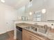 Bright kitchen featuring granite countertops, a stainless steel dishwasher, and a view into a living space at 301 E Tremont Ave, Charlotte, NC 28203