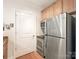 Compact kitchen featuring stainless steel appliances and ample storage space at 301 E Tremont Ave, Charlotte, NC 28203