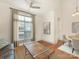 Bright living room with a large window and a view into the dining area at 301 E Tremont Ave, Charlotte, NC 28203