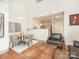 Open-concept living space featuring dining area, kitchen, and comfortable seating at 301 E Tremont Ave, Charlotte, NC 28203