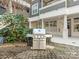Outdoor stainless steel grill in courtyard area with manicured landscaping and neutral color building at 301 E Tremont Ave, Charlotte, NC 28203