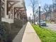 Street view of commercial building with sidewalk, grass, and street with parked cars at 301 E Tremont Ave, Charlotte, NC 28203