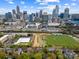 Beautiful aerial view of a property with a lush green field and the city skyline in the background at 306 S Cedar St # 10, Charlotte, NC 28202