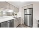 Well-lit kitchen featuring stainless steel appliances, a modern sink, and attractive countertops at 306 S Cedar St # 10, Charlotte, NC 28202