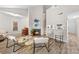 Spacious living room with a fireplace, piano, and modern decor, perfect for entertaining at 306 S Cedar St # 10, Charlotte, NC 28202