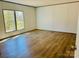 Bright bedroom features hardwood floors and natural light at 3144 Rickwood Dr, Newton, NC 28658